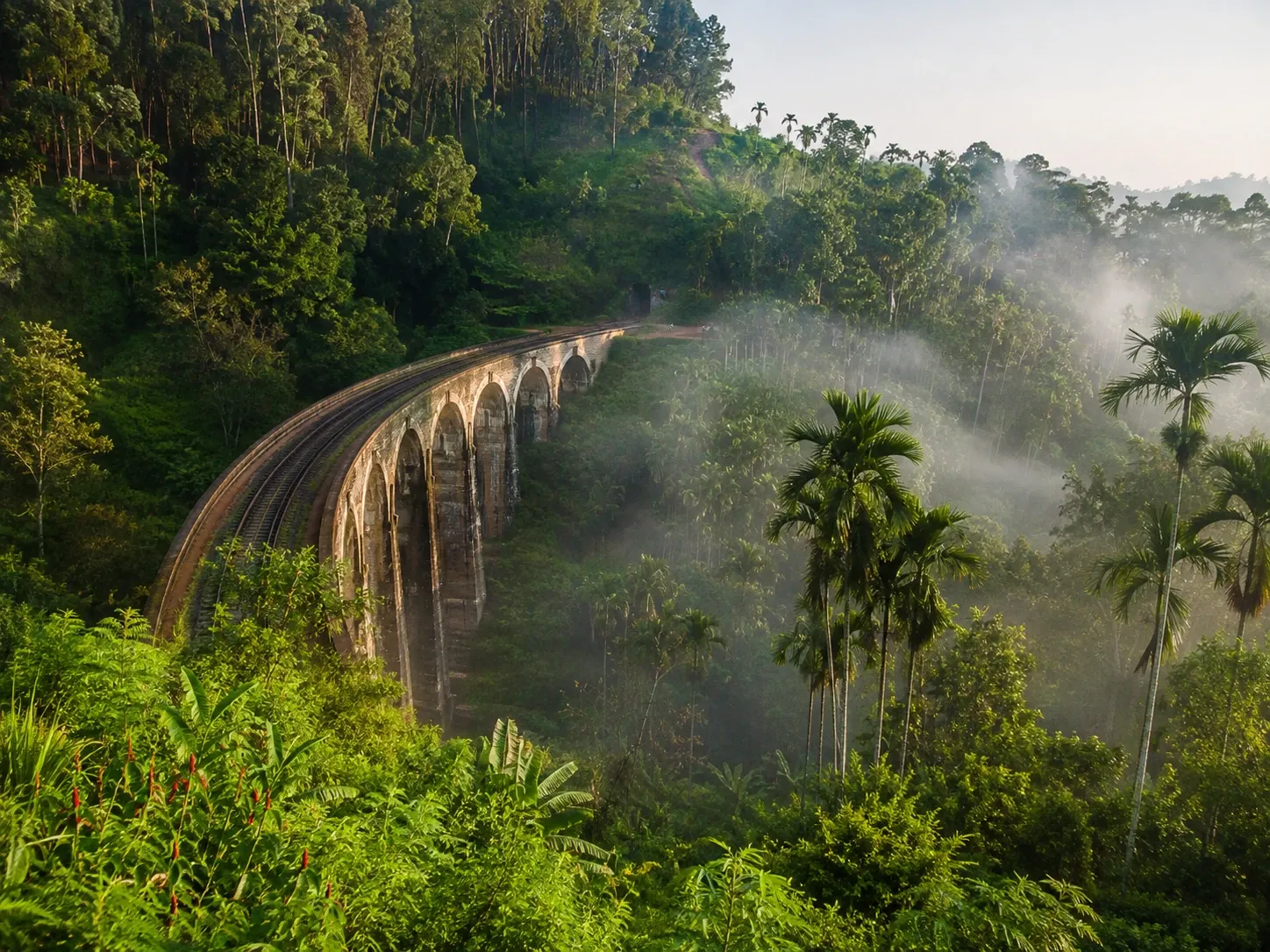 The Nine Arch Bridge spanning a misty jungle valley at Ella in the Uva Highlands, Sri Lanka