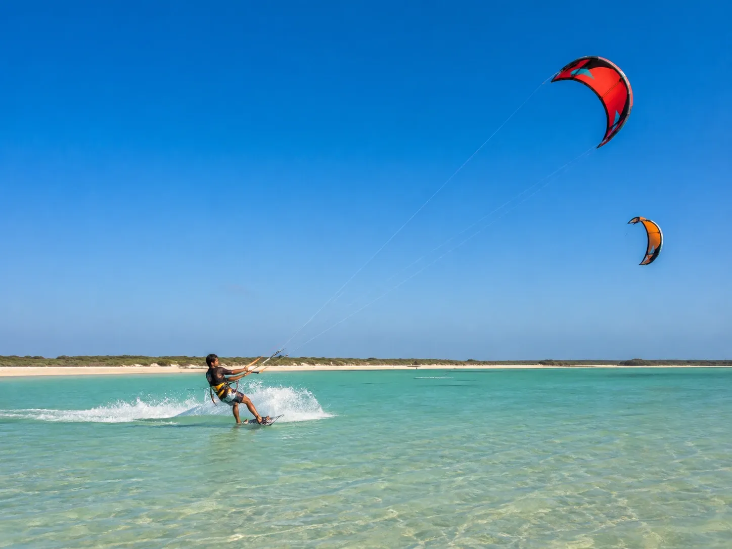 Kitesurfers crossing the shallow turquoise lagoon at Kalpitiya on the northwest coast of Sri Lanka